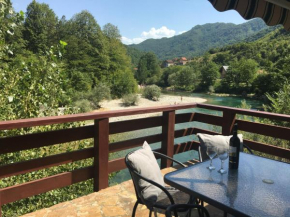 Cozy house next to river Neretva in nature